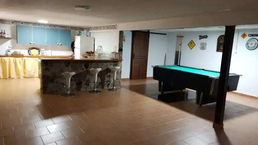cocina y sala de Casa Rural Herrén de la Cañada